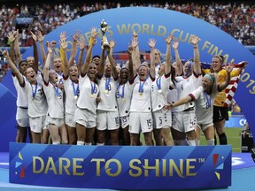 FILE - Team USA celebrates after winning the Women's World Cup soccer final against the Netherlands at the Stade de Lyon in Decines, outside Lyon, France, Sunday, July 7, 2019. The United States will be playing for an unprecedented three-peat at the Women's World Cup this summer.