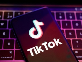 The TikTok logo in front of a keyboard.