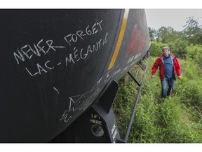 "All those who live within 300 metres of the tracks — every time they see those tankers that roll all the time through the town, loaded with propane gas, with sulphuric acid or with chlorine — they feel a chill in their spine," said Robert Bellefleur, spokesperson for the local rail safety coalition in Lac-Mégantic. Beside him is a tanker from the freight train that derailed, killing 47 people in 2013.