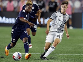 Toronto FC's Themi Antonoglou (81) and New England Revolution's Latif Blessing (19) compete for the ball earlier this season.