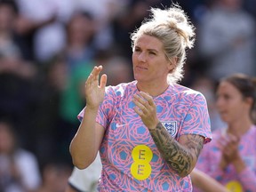 Millie Bright of England acknowledges the fans following a friendly match.