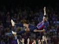 Barcelona's Jordi Alba is thrown in the air by teammates after his last home game with the team.