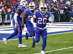 Buffalo Bills running back Nyheim Hines celebrates after running in a touchdown on a punt return.