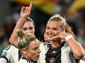 Germany forward Alexandra Popp celebrates with teammates after scoring against Morocco.