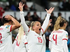 Canada's Adriana Leon celebrates scoring her team's second goal against Ireland.