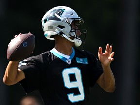 Bryce Young of the Carolina Panthers attempts a pass during training camp.