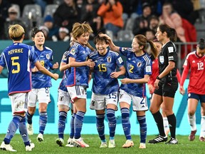 Japan midfielder Aoba Fujino (centre) celebrates scoring her team's second goal with teammates against Costa Rica.