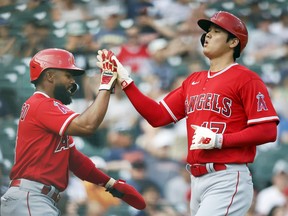 Los Angeles Angels' Luis Rengifo celebrates with Shohei Ohtani after they scored against the Detroit Tigers.