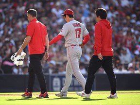 Shohei Ohtani of the Los Angeles Angels walks to the dugout.