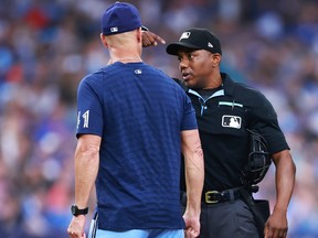 Pitching Coach Pete Walker of the Blue Jays is thrown out of the game by umpire Malachi Moore in the second inning against the San Diego Padres at Rogers Centre on July 18, 2023 in Toronto.