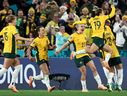 Australia's players celebrate after defender #07 Stephanie Catley scored a penalty during the Australia and New Zealand 2023 Women's World Cup Group B football match between Australia and Ireland at Stadium Australia, also known as Olympic Stadium, in Sydney on July 20, 2023.  