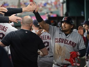 Josh Naylor of the Cleveland Guardians is congratulated by teammates after hitting a two-run home run during the third inning against the Texas Rangers at Globe Life Field on July 14, 2023 in Arlington, Texas.