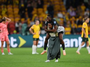 Asisat Oshoala (top) and Gift Monday of Nigeria celebrate