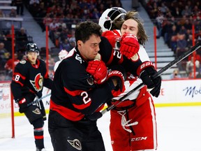 Ottawa Senators defenceman Artem Zub fights Detroit Red Wings winger Tyler Bertuzzi.
