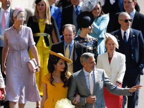 Actor George Clooney and his wife, British lawyer Amal Clooney, arrive for the wedding ceremony of Britain's Prince Harry, Duke of Sussex and actress Meghan Markle at St George's Chapel, Windsor Castle, in Windsor, on May 19, 2018.