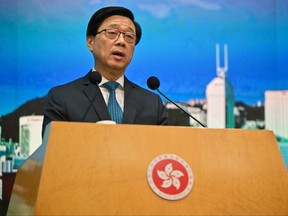 (FILES) Hong Kong's Chief Executive John Lee