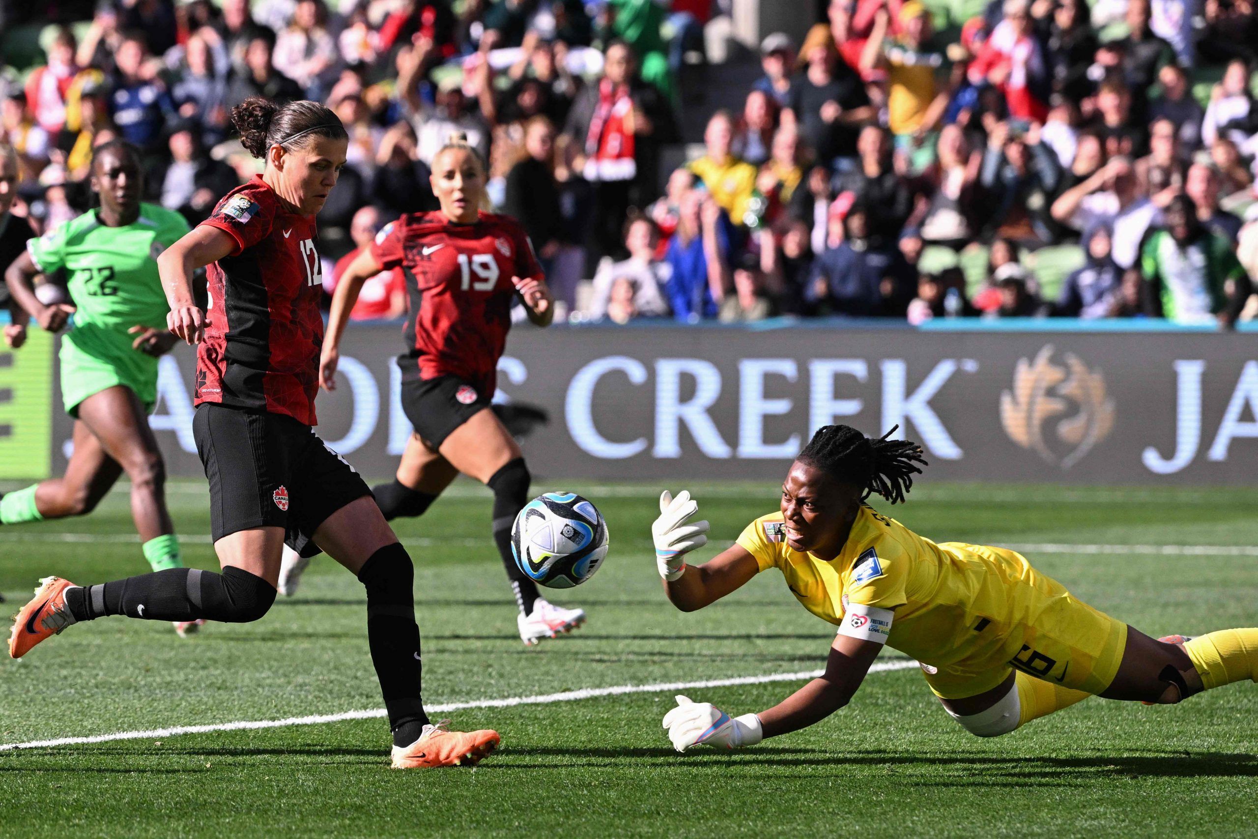 Nigeria's goalkeeper #16 Chiamaka Nnadozie (R) clears after saving a penalty kick by Canada's forward #12 Christine Sinclair during the Australia and New Zealand 2023 Women's World Cup Group B football match between Nigeria and Canada at Melbourne Rectangular Stadium, also known as AAMI Park, in Melbourne on July 21, 2023. 