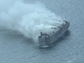 This handout photograph taken and released on July 26, 2023 by the Dutch coastguards, shows a fire aboard the Panamanian-registered car carrier ship Fremantle Highway, off the coast of the northern Dutch island of Ameland.