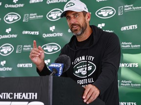 Quarterback Aaron Rodgers of the New York Jets talks to reporters after training camp at Atlantic Health Jets Training Center on July 26, 2023 in Florham Park, N.J.