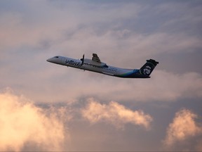 In this file photo taken on Aug. 11, 2018, an Alaska Airlines Bombardier Dash 8 Q400 operated by Horizon Air takes off