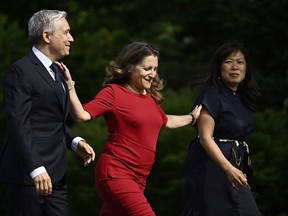 Francois-Philippe Champagne, left to right, Chrystia Freeland and Mary Ng arrive for a cabinet swearing-in ceremony at Rideau Hall in Ottawa on Wednesday, July 26, 2023. THE CANADIAN PRESS/Justin Tang