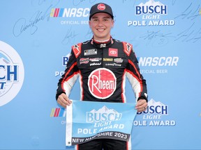Christopher Bell, driver of the number 20 Rheem/WATTS Toyota, poses for photos after winning the pole award