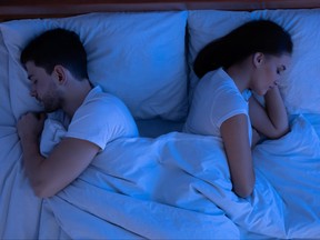 Couple sleeping having no sexual life in bed