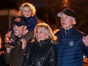 US President Joe Biden, right, with son Hunter Biden, grandson Beau, and First Lady Jill Biden