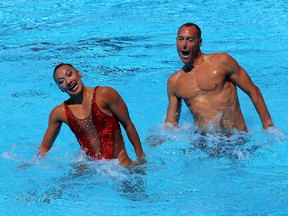 Bill May of the United States and Kanako Kitao Spendlove of the United States compete during the Synchronized Swimming Mixed Duet Technical final