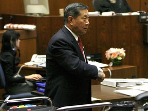 Forensic scientist Dr. Henry C. Lee exits the courtroom
