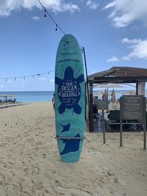 This surfboard in the sand greets guests of The Westin Grand Cayman Seven Mile Beach Resort and Spa. The cabanas behind are just the first way to enjoy one of the greatest beaches in the entire world.