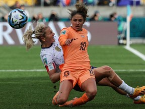 Netherlands' midfielder Danielle van de Donk fights for the ball with USA's midfielder Lindsey Horan during the Australia and New Zealand 2023 Women's World Cup Group E football match between the United States and the Netherlands at Wellington Stadium, also known as Sky Stadium, in Wellington on July 27, 2023.