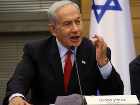 Israeli Prime Minister Benjamin Netanyahu gives a statement to the media before the vote on the national budget, on May 23, 2023, at the parliament in Jerusalem.