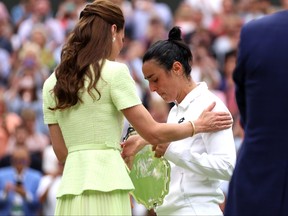 Ons Jabeur of Tunisia looks dejected as she is consoled by Catherine, Princess of Wales following defeat in the Women's Singles Final against Marketa Vondrousova of Czech Republic on day 13  of The Championships Wimbledon 2023 at All England Lawn Tennis and Croquet Club on July 15, 2023 in London.