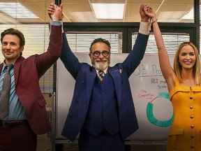 Chris Evans, Andy Garcia and Emily Blunt in a scene from Pain Hustlers.