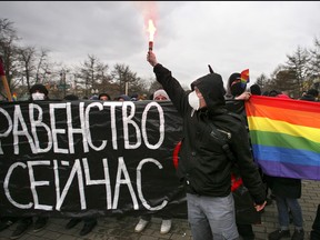 In this file photo taken on March 8, 2008, supporters of Russia's gay, lesbian and transgender movement hold a rally in central Moscow