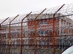 A security fence surrounds the inmate housing on Rikers Island correctional facility in New York.