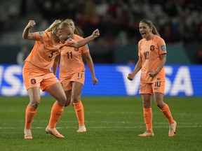 Netherlands' Stefanie Van der Gragt, left, celebrates with teammates after her goal was confirmed