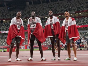 Canada's 4 X100-metre relay team (left to right) Aaron Brown, Jerome Blake, Brendon Rodney and Andre De Grasse celebrate their bronze medal win during the Tokyo Olympics in Tokyo, Japan on Friday, Aug.6, 2021.