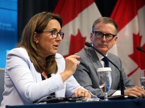 Tiff Macklem (right), Governor of the Bank of Canada, listens as Carolyn Rogers, Senior Deputy Governor, speaks