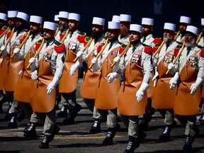 French Foreign Legion march during the Bastille Day military parade on the Champs-Elysees avenue in Paris
