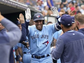 Toronto Blue Jays' George Springer celebrates his two-run home run against the Detroit Tigers in the fourth inning of a baseball game, Friday, July 7, 2023, in Detroit.&ampnbsp;The Toronto Blue Jays have reinstated Springer from the paternity list, the team announced Monday.