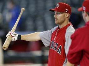 Canada's Peter Orr, a former member of the Toronto Maple Leafs baseball team, watches batting practice prior to a World Baseball Classic baseball game against Mexico, Saturday, March 9, 2013, in Phoenix.