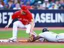Jorge Mateo of the Baltimore Orioles is tagged out by Matt Chapman of the Toronto Blue Jays as he tries to steal third base at Rogers Centre on July 31, 2023 in Toronto. 