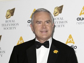 Journalist Huw Edwards poses for photographers