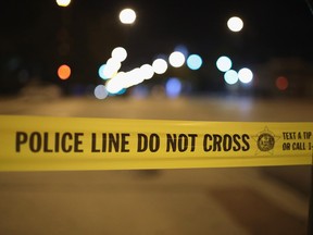 Police investigate the scene of a shooting in Chicago