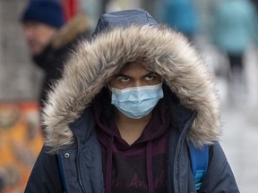 A person wears a surgical mask