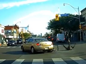 Video was rolling as a cyclist was run over and dragged by a car in midtown Toronto, on Yonge St. at Ranleigh Ave., on Wednesday, July 19, 2023.