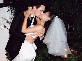 Ariana Grande and Dalton Gomez are pictured at their wedding in May 2021.