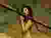 Half-dressed woman holding a missile launcher.